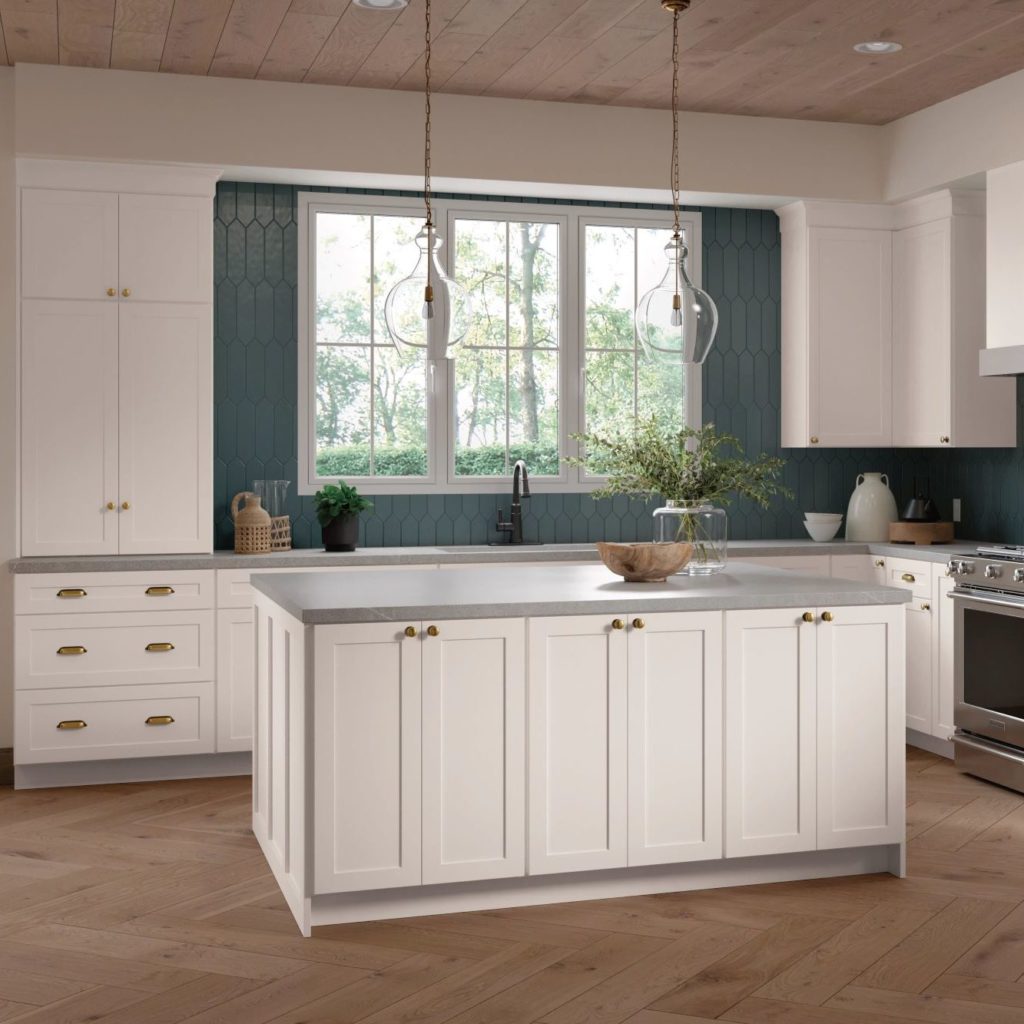 White Shaker Kitchen Cabinets and Work Island in L-Shaped Kitchen - Omni Cabinet Door Style in Snow Finish by Mantra Cabinets