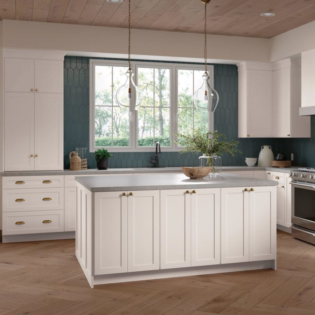 White Shaker Kitchen Cabinets and Work Island in L-Shaped Kitchen - Omni Cabinet Door Style in Snow Finish by Mantra Cabinets