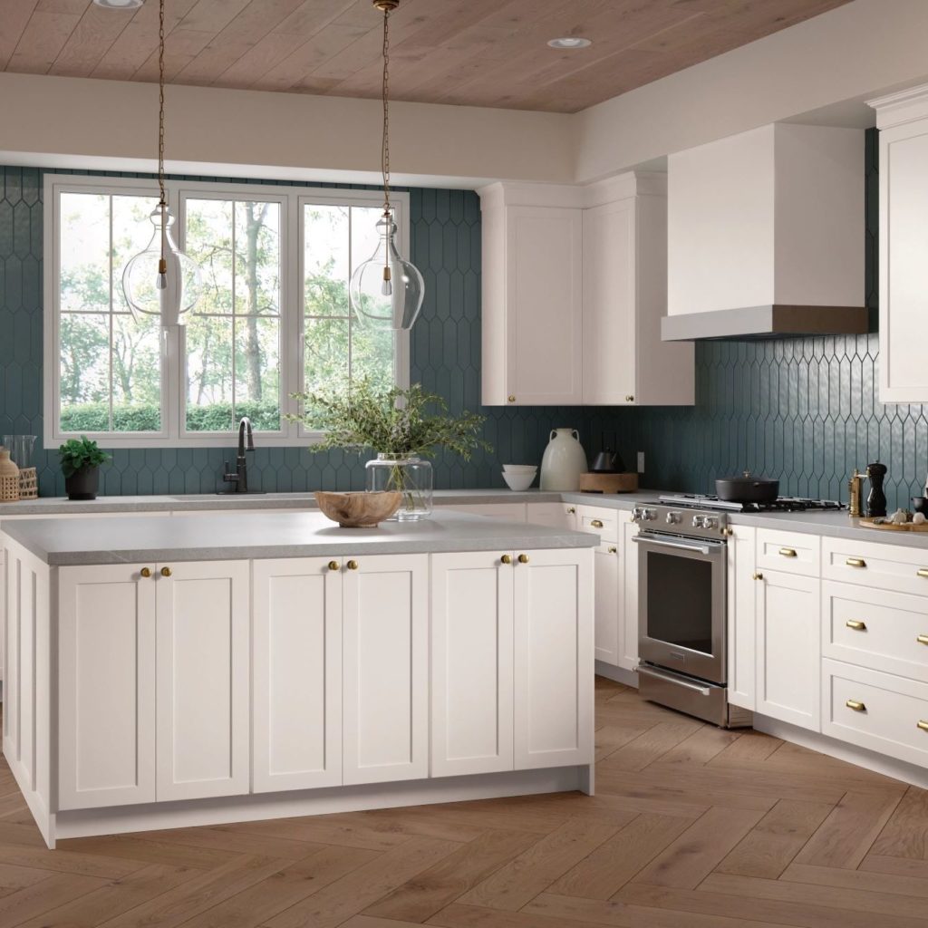 White Shaker Kitchen Cabinets and Work Island in L-Shaped Kitchen - Omni Cabinet Door Style in Snow Finish by Mantra Cabinets