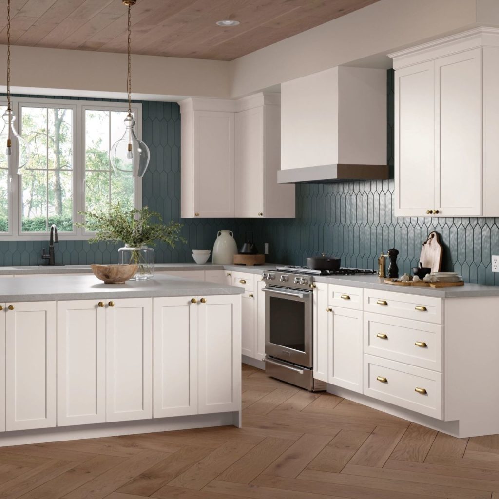 White Shaker Kitchen Cabinets and Work Island in L-Shaped Kitchen - Omni Cabinet Door Style in Snow Finish by Mantra Cabinets