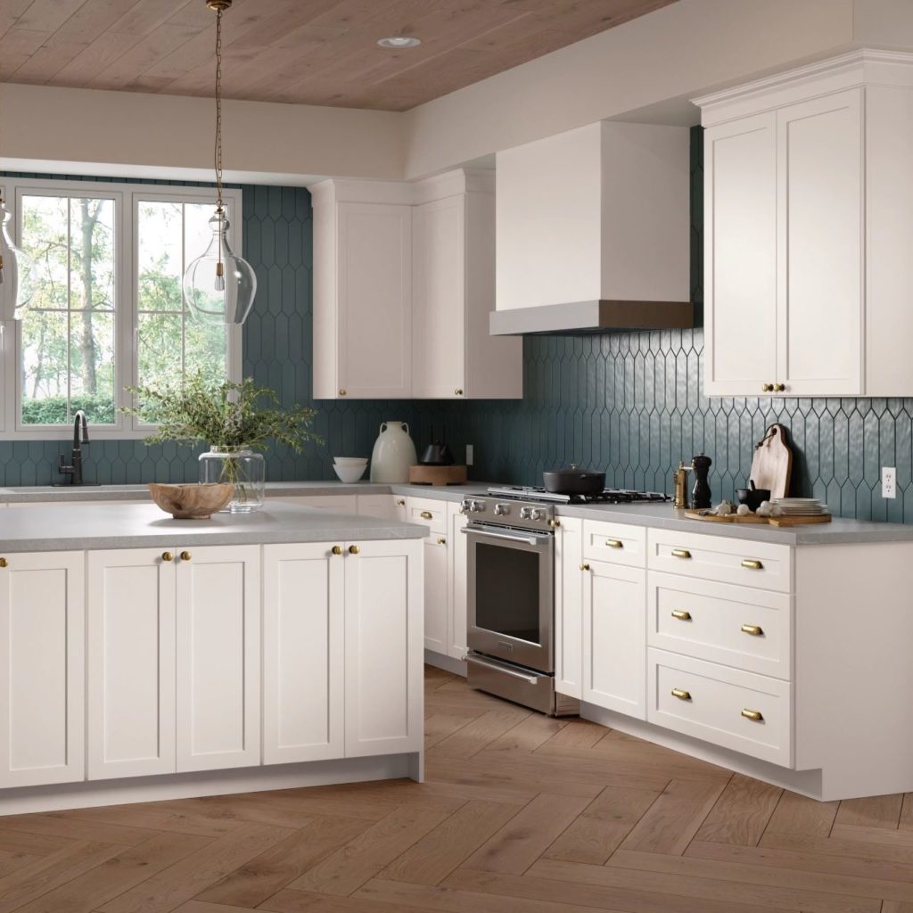 White Shaker Kitchen Cabinets and Work Island in L-Shaped Kitchen - Omni Cabinet Door Style in Snow Finish by Mantra Cabinets