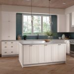 White Shaker Kitchen Cabinets and Work Island in L-Shaped Kitchen - Omni Cabinet Door Style in Snow Finish by Mantra Cabinets