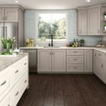 Kitchen Cabinets in Spectra Cabinet Door Style in Mineral Finish and Island in Snow Finish