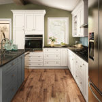 White Shaker Kitchen Cabinets and Deep Gray Island - Spectra Cabinet Door Style in Snow Finish and Omni Cabinet Door Style in Graphite Finish from Mantra Cabinets
